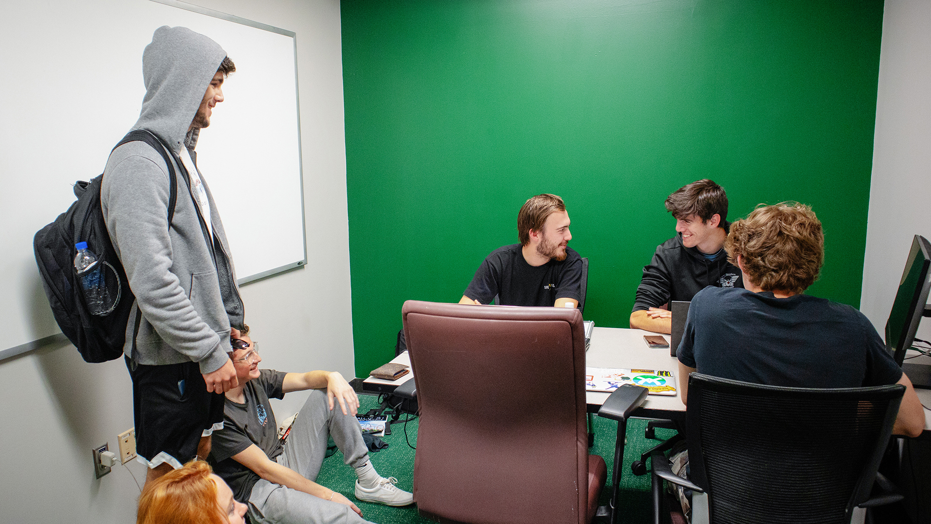 freshly painted study rooms with a green accent wall