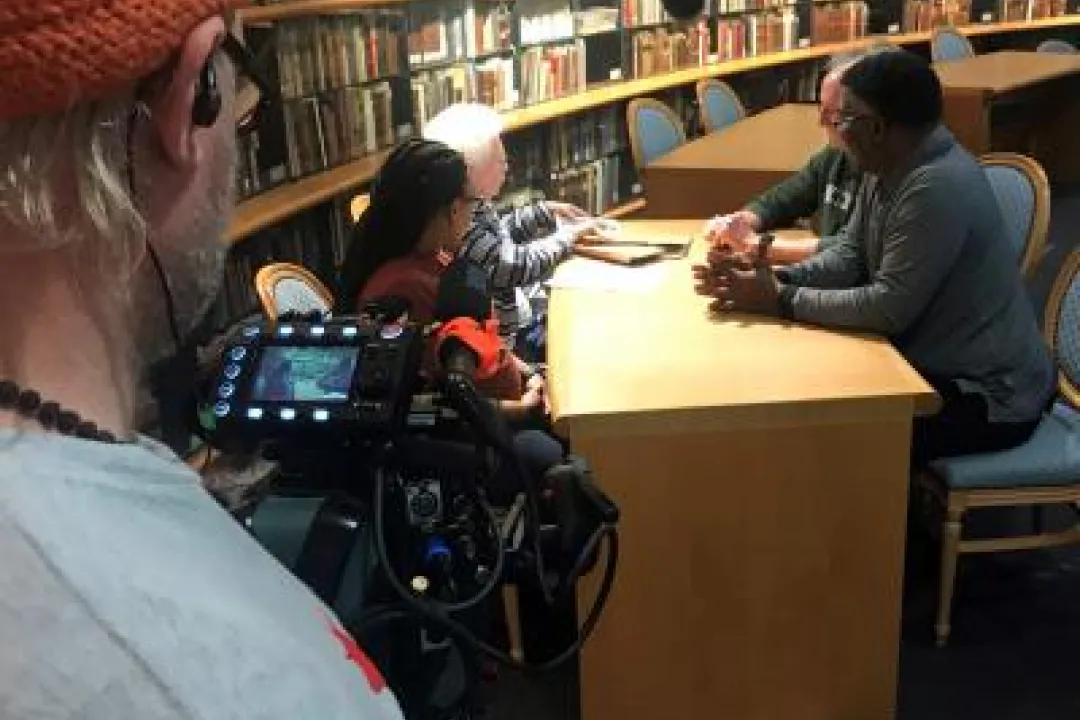 Image of a film shoot in Dalton Reading Room