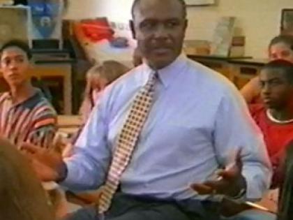 Harvey Gantt in a classroom speaking to children